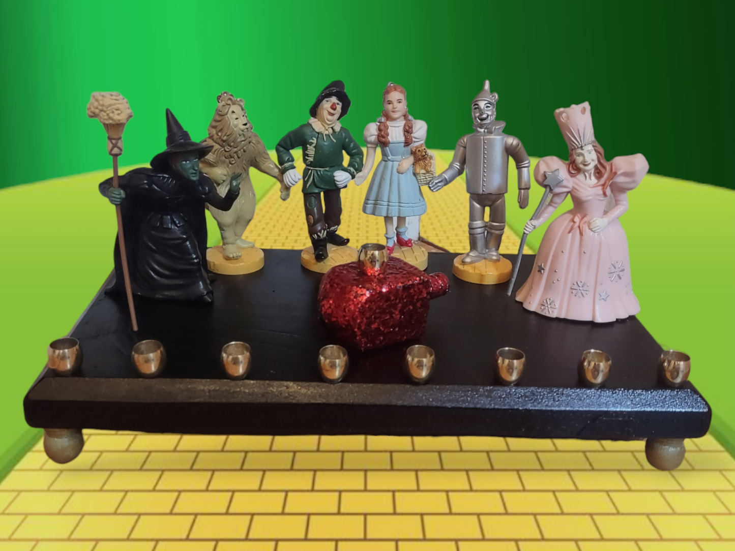 One of kind Collector Wizard of Oz Menorah with ruby red dreidel

Hand-crafted Wizard of Oz Menorah from repurposed figures, wood dreidel, wood plaque, brass candle cups, acrylic paint and glitter.

This Collectors Menorah will make a statement for your H