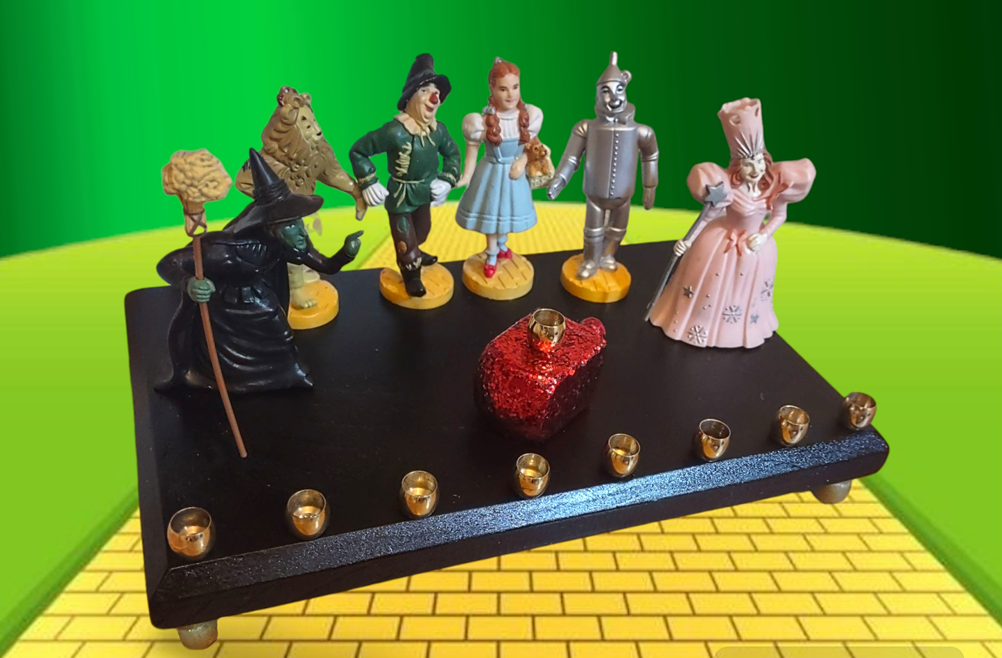 One of kind Collector Wizard of Oz Menorah with ruby red dreidel

Hand-crafted Wizard of Oz Menorah from repurposed figures, wood dreidel, wood plaque, brass candle cups, acrylic paint and glitter.

This Collectors Menorah will make a statement for your H