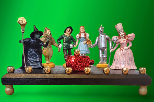 One of kind Collector Wizard of Oz Menorah with ruby red dreidel

Hand-crafted Wizard of Oz Menorah from repurposed figures, wood dreidel, wood plaque, brass candle cups, acrylic paint and glitter.

This Collectors Menorah will make a statement for your H