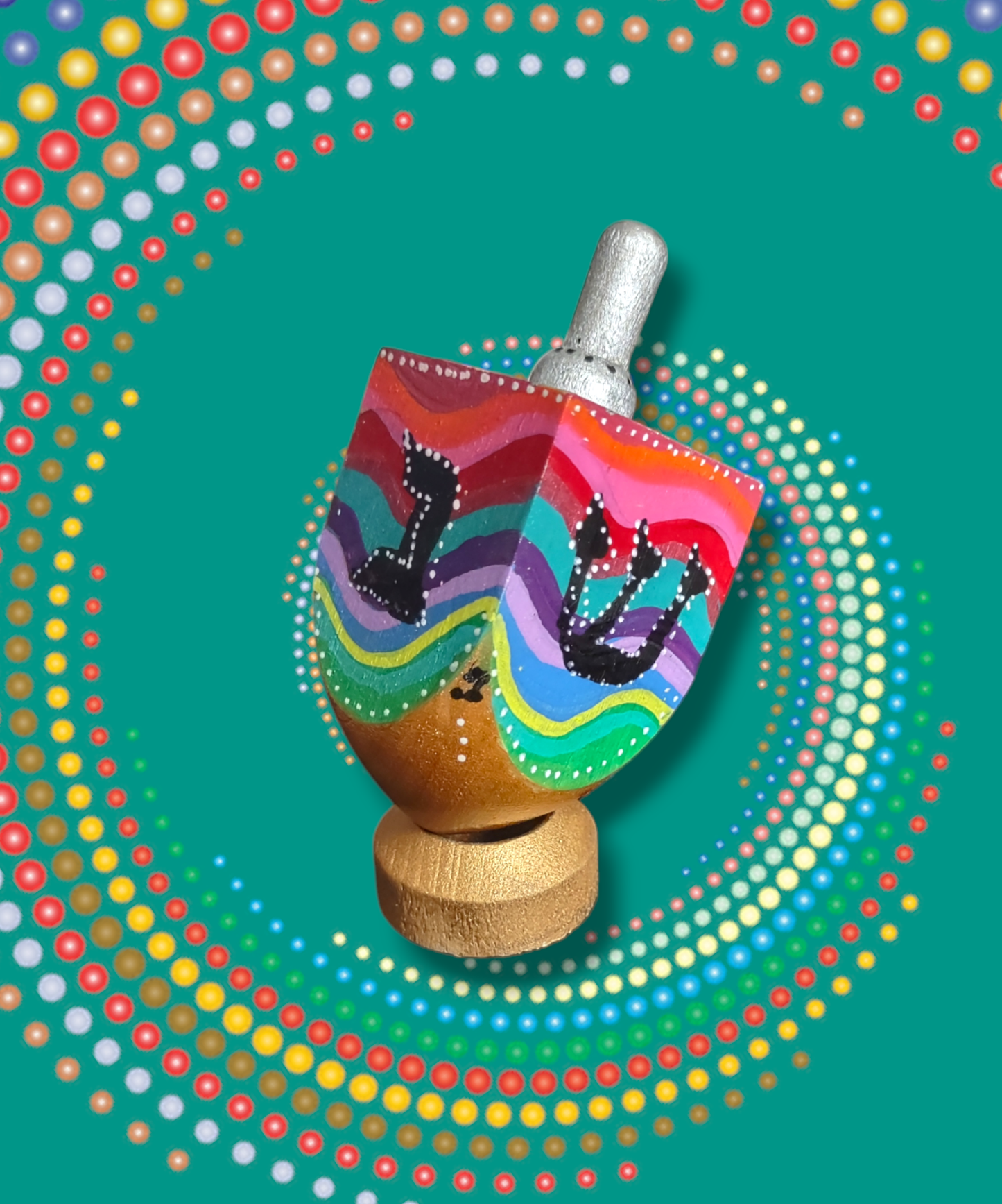 Hand-painted swirly colorful dreidel.