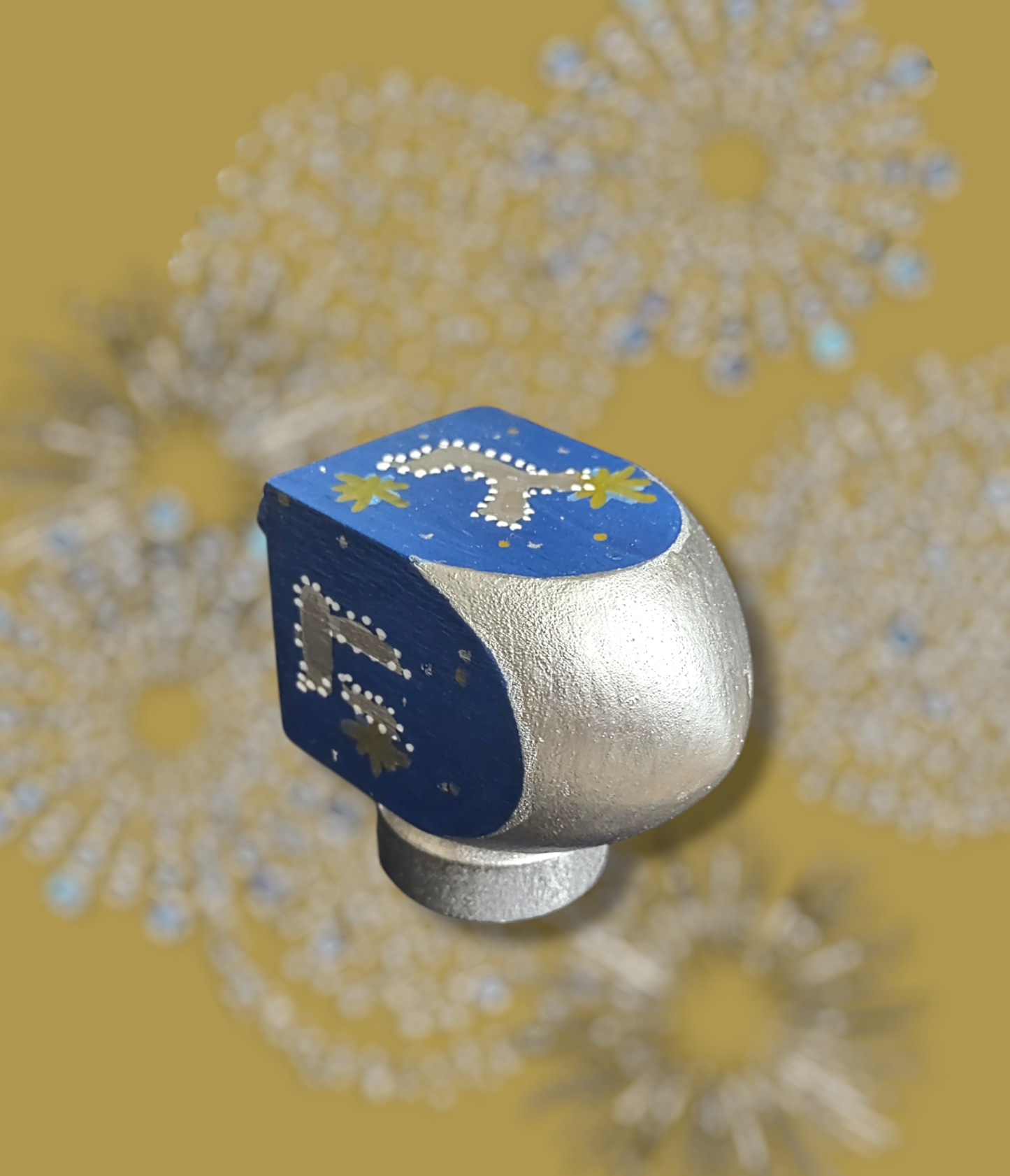 Hand-painted blue gold and silver dreidel.