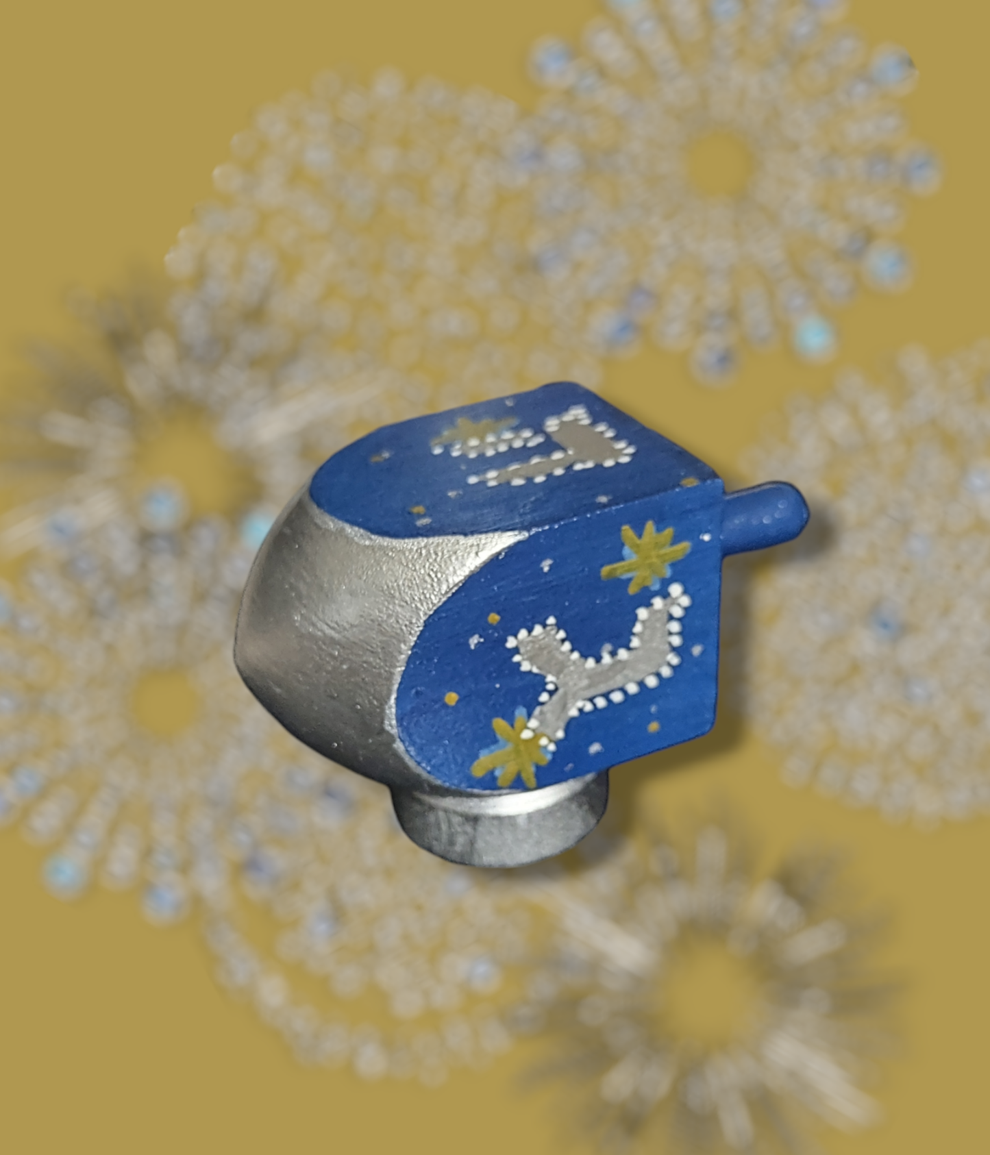 Hand-painted blue gold and silver dreidel.