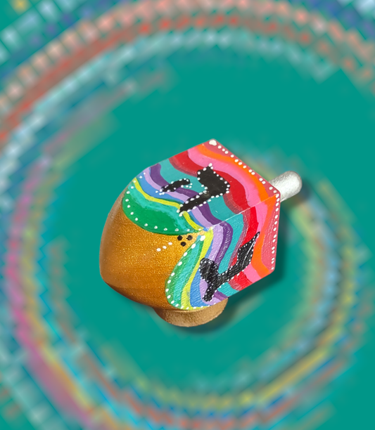 Hand-painted swirly colorful dreidel.